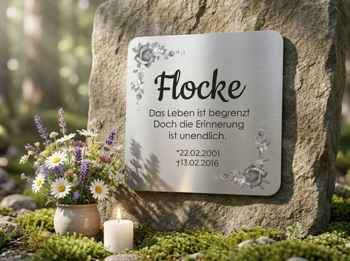 Am Grab mit Blumen